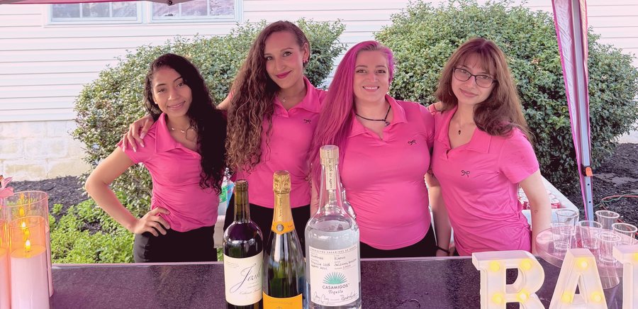 Pretty Pink staff serving at the bar
